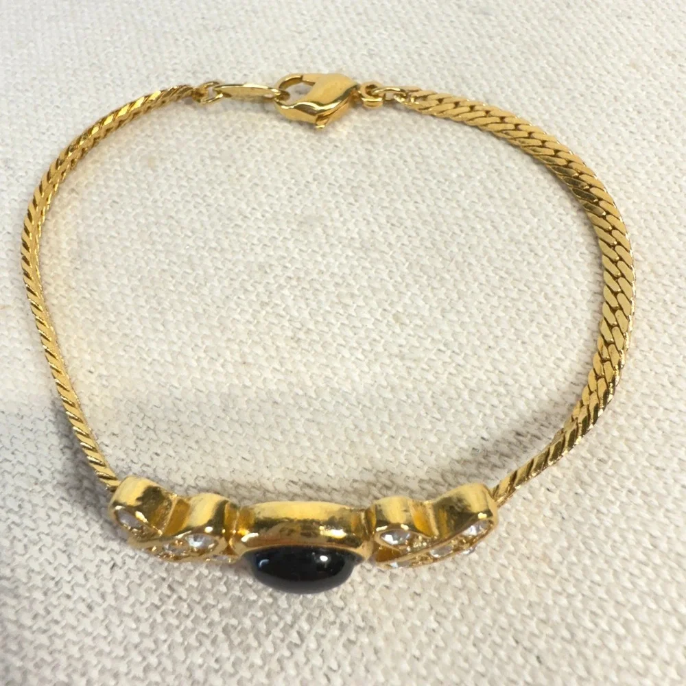Avon Gold Tone Bracelet with Black Stone and Rhinestone Accents‎ Xs and Os XOX